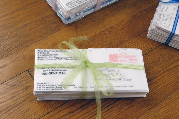 documentation photo of a bundle of letters tied with ribbon